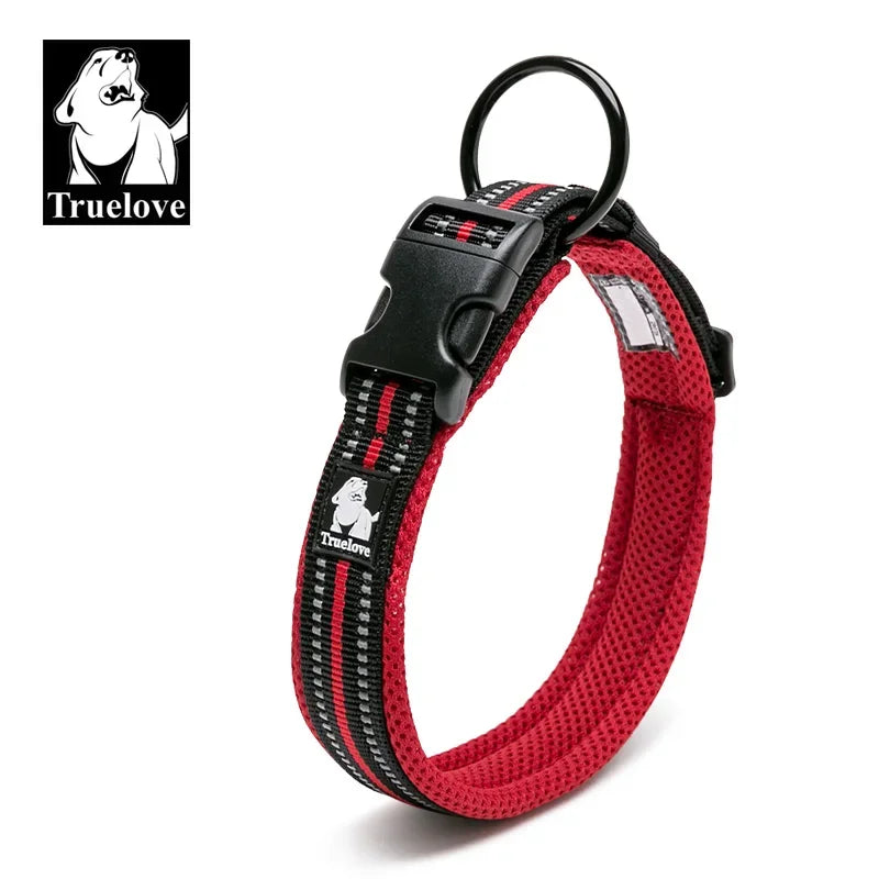 Red and black dog collar with visible 'Truelove' branding on a white background