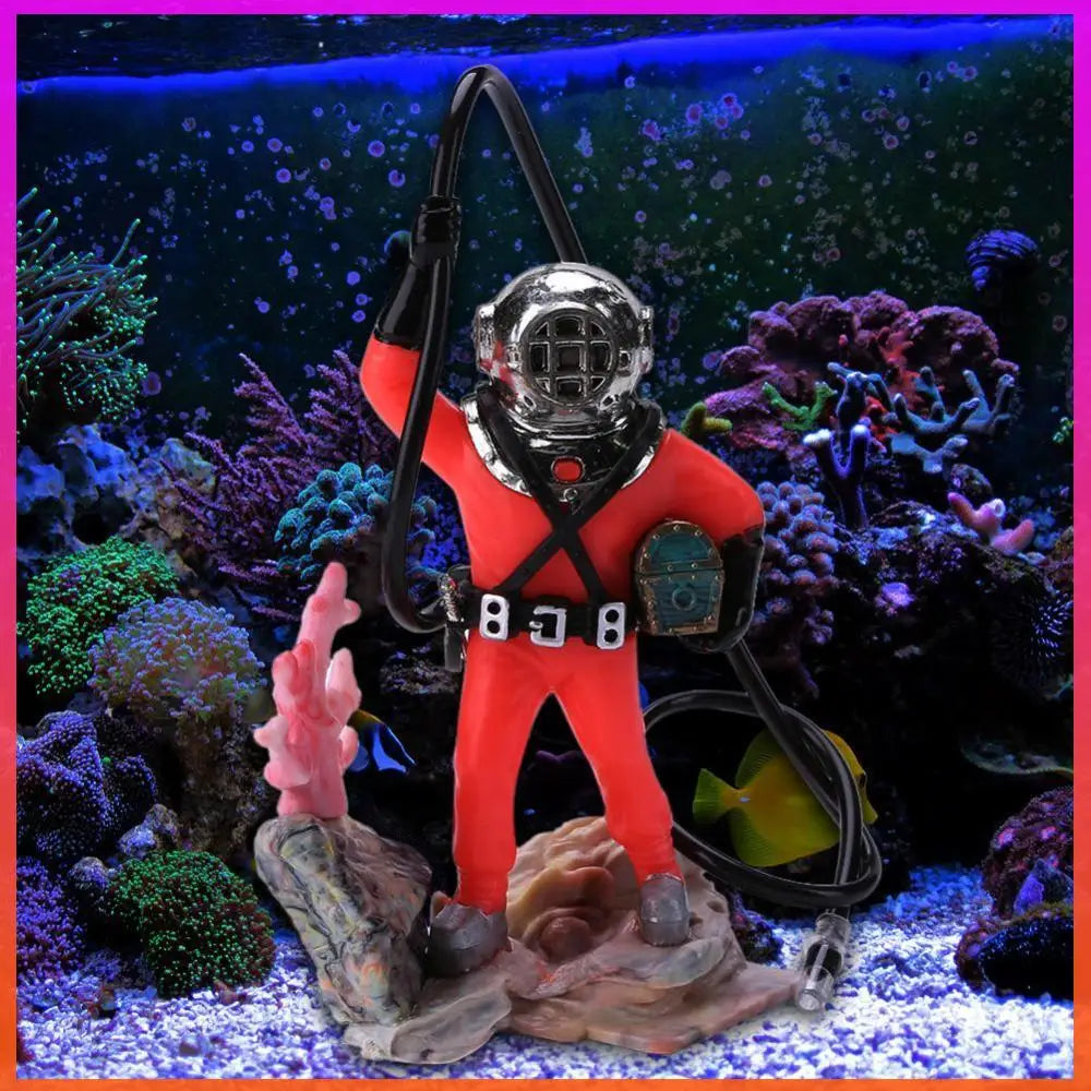 Decorative figure of a diver in a red suit with a silver helmet on a coral reef background.