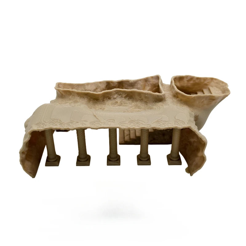 Ceramic model of a classical temple with columns on a white background