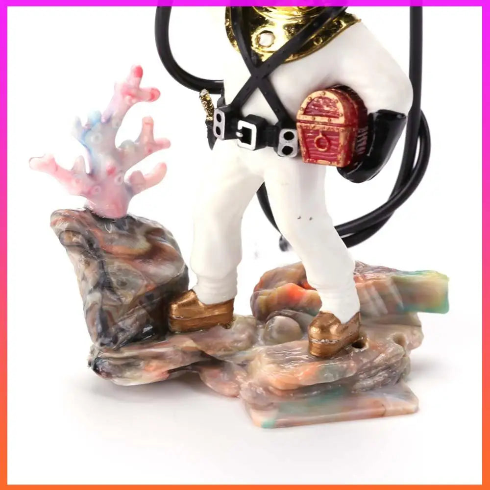 Decorative figurine with a white horse-like creature on a rocky base, wearing gold armor and holding a red bag.