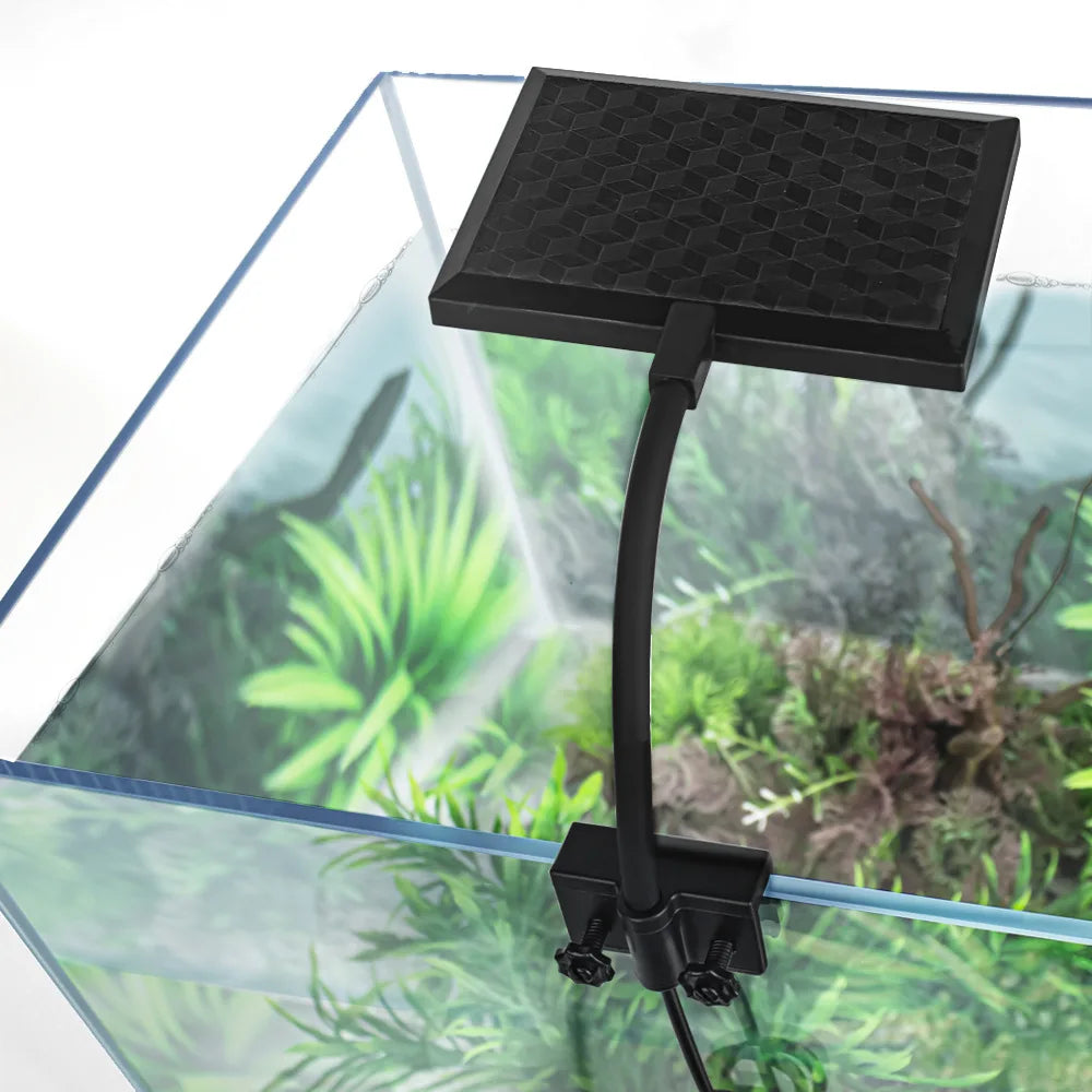Black aquarium filter with a long arm attached to an aquarium.
